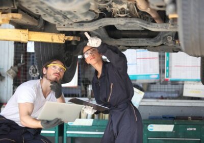 young-mechanics-working-garage